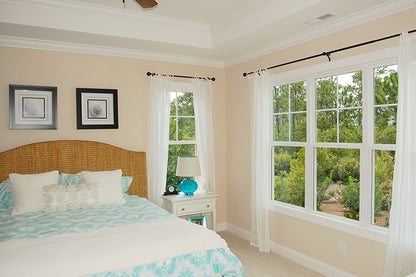 Tray ceiling and lots of windows in the master bedroom. The Pemberton plan 972.