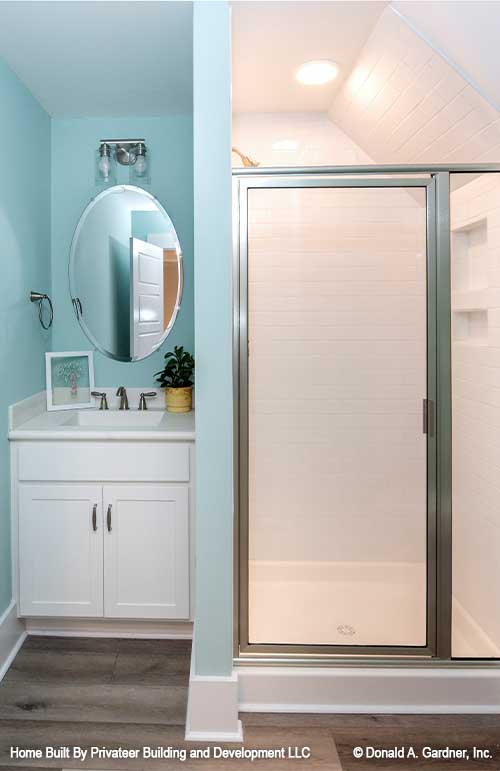 Single vanity beside a walk-in shower. Percy plan 1503