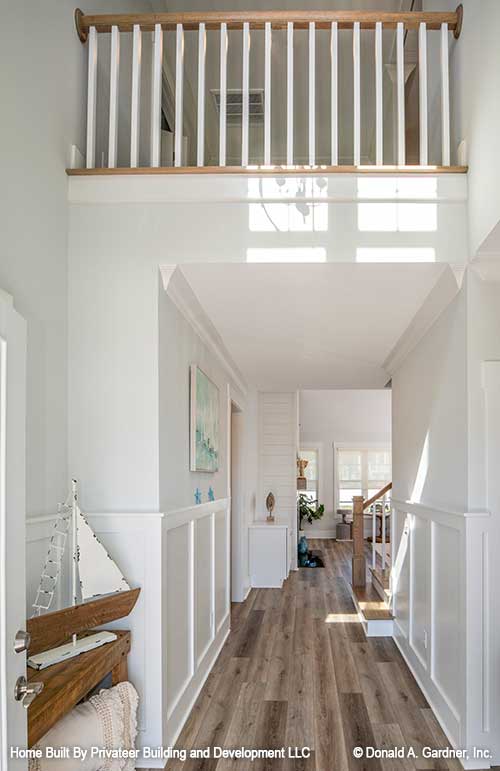 Step into the foyer, looking above to the banister. Percy plan 1503