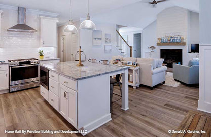 Kitchen island with seating in the kitchen. Percy plan 1503