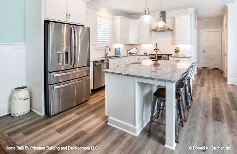 Side view of the kitchen with double door fridge.  Percy plan 1503