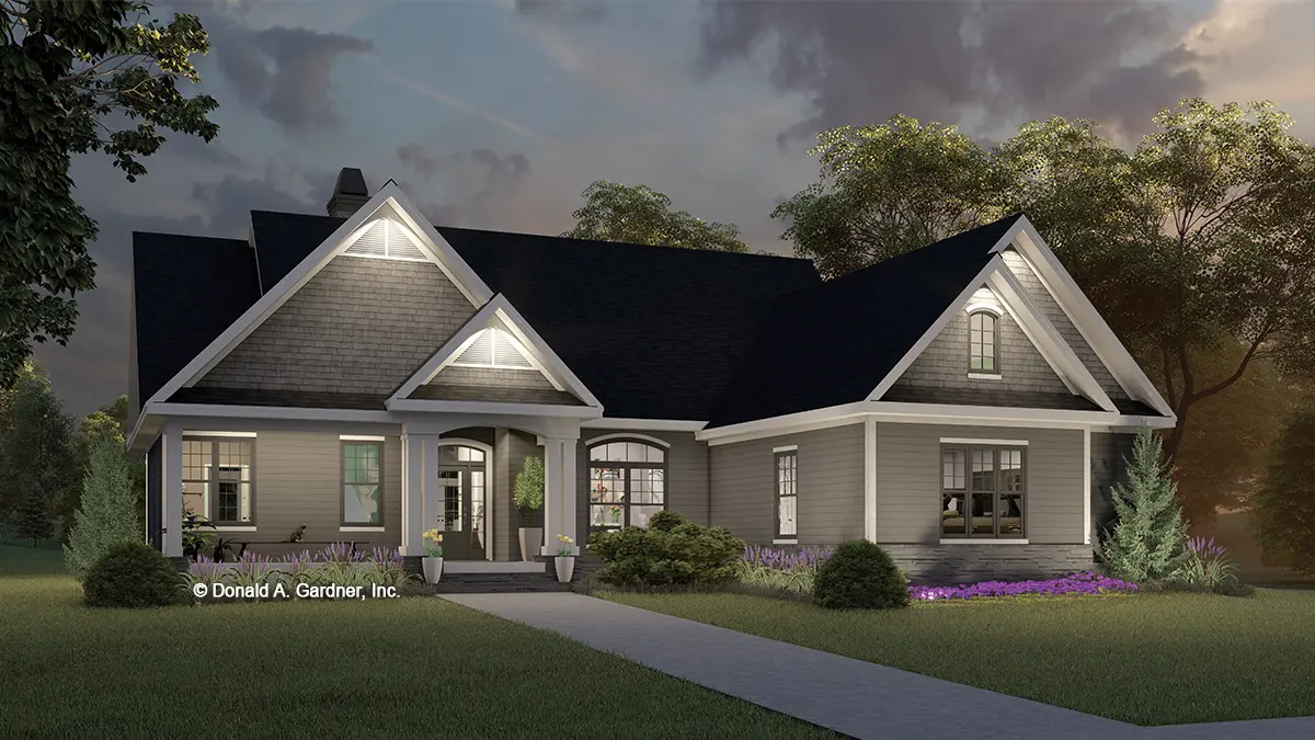 This is an illustration of the front of three bedroom house plan 731 The Periwinkle at dusk