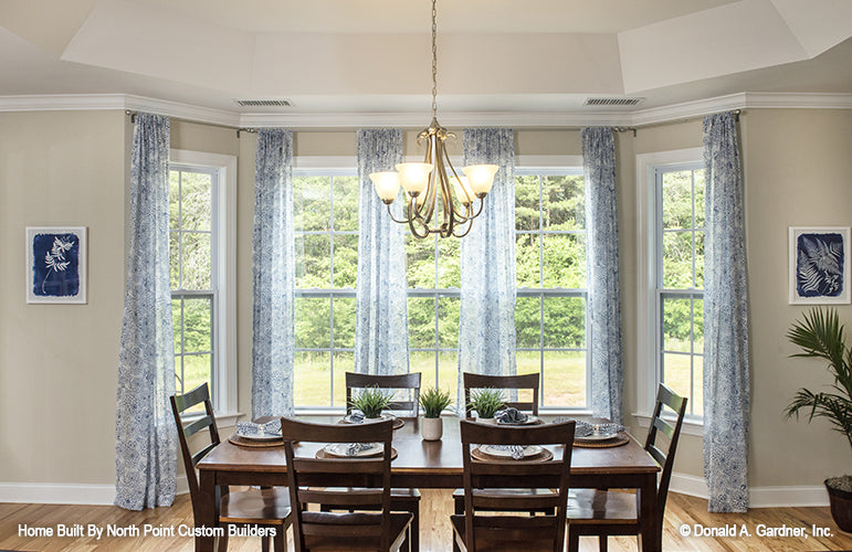 Tray ceiling and chandelier in the dining room. The Peyton plan 1289.