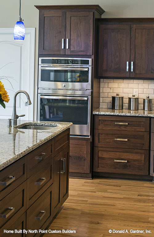 Drawers and a second sink on the kitchen island. The Peyton plan 1289.