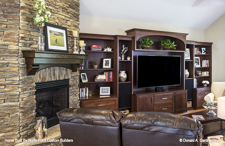 Dark brown entertainment center in the living room. The Peyton plan 1289.