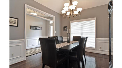 Wainscoting and flat ceiling in the dining room. The Pinebluff plan 1036.