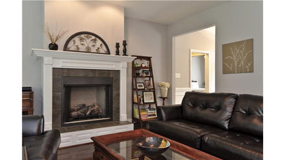 Fireplace with a mantle in the great room. The Pinebluff plan 1036.