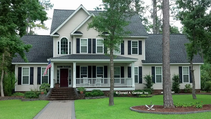 This is a photograph of the front of country house plan 405 The Pineville as built by a customer