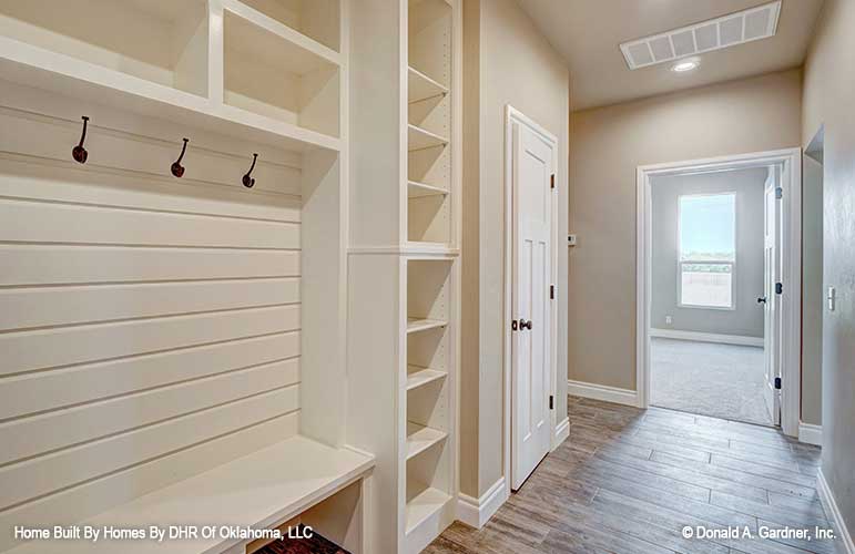 Transition from outdoors and drop your gear in the mud room in small house plan 1316 The Primrose