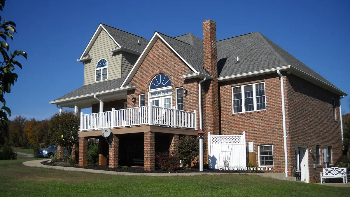 Side view photograph with a side patio deck. The Radcliffe plan 799.