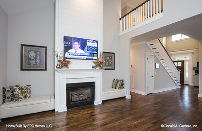 This is a great room picture showing second floor stairs of simple house plan 1108 The Radford