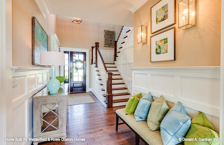 Staircase to second level in the foyer. The Rangemoss plan 1211.