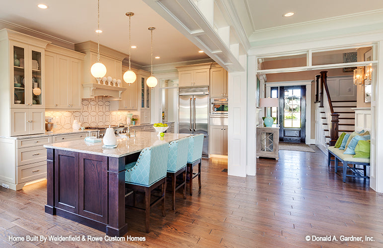 Kitchen island with a sink and seating. The Rangemoss plan 1211.