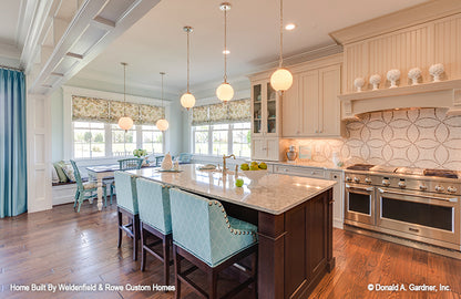 Wood flooring in the kitchen. The Rangemoss plan 1211.