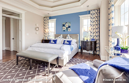 Blue accent wall in the master bedroom. The Rangemoss plan 1211.