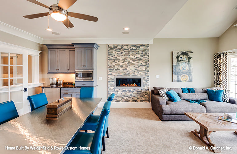 Fireplace and kitchenette in the rec room. The Rangemoss plan 1211.