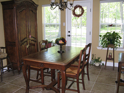 This is a photograph of the dining room of three bedroom house plan 915 The Remington as built by a customer