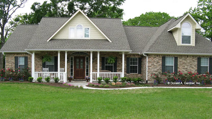 This is a photograph of the front of three bedroom house plan 915 The Remington as built by a customer