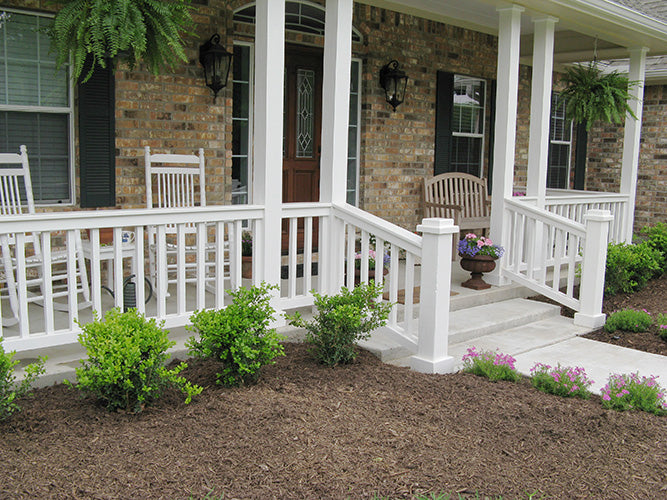 This is a photograph of the front porch of three bedroom house plan 915 The Remington as built by a customer