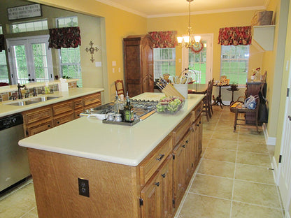 This is a photograph of the kitchen island of three bedroom house plan 915 The Remington as built by a customer