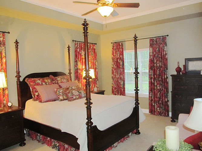 This is a photograph of the master bedroom of three bedroom house plan 915 The Remington as built by a customer