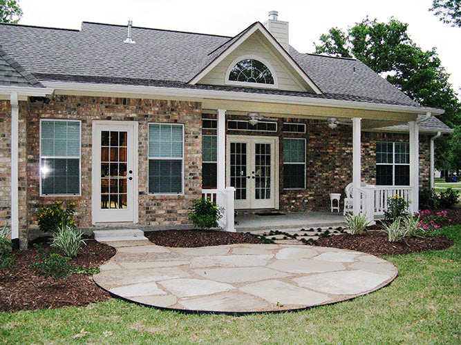 This is a photograph of the patio of three bedroom house plan 915 The Remington as built by a customer