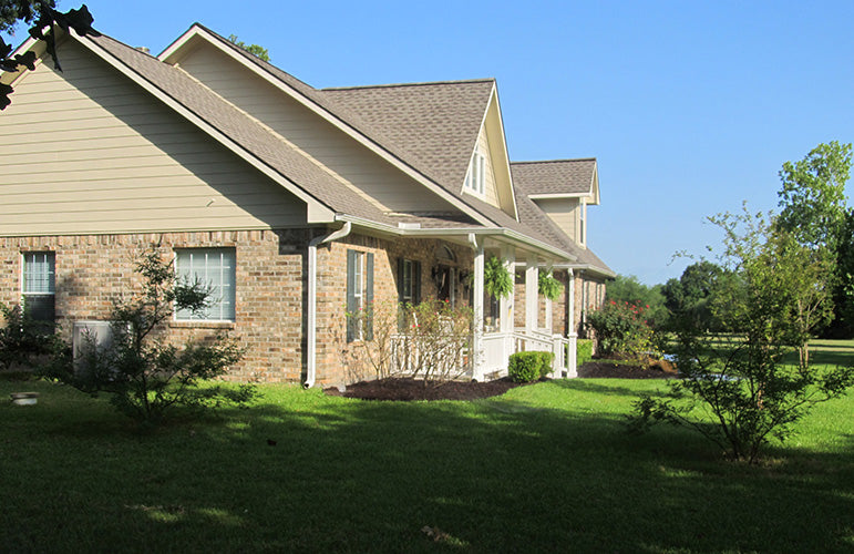 This is a photograph of the side exterior of three bedroom house plan 915 The Remington as built by a customer