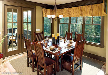 Brown trim about the ceiling and windows in the dining room. The Riva Ridge plan 5013.