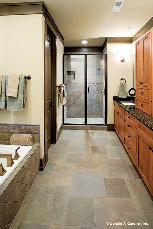 Walk way to the walk-in shower in the master bathroom. The Riva Ridge plan 5013.