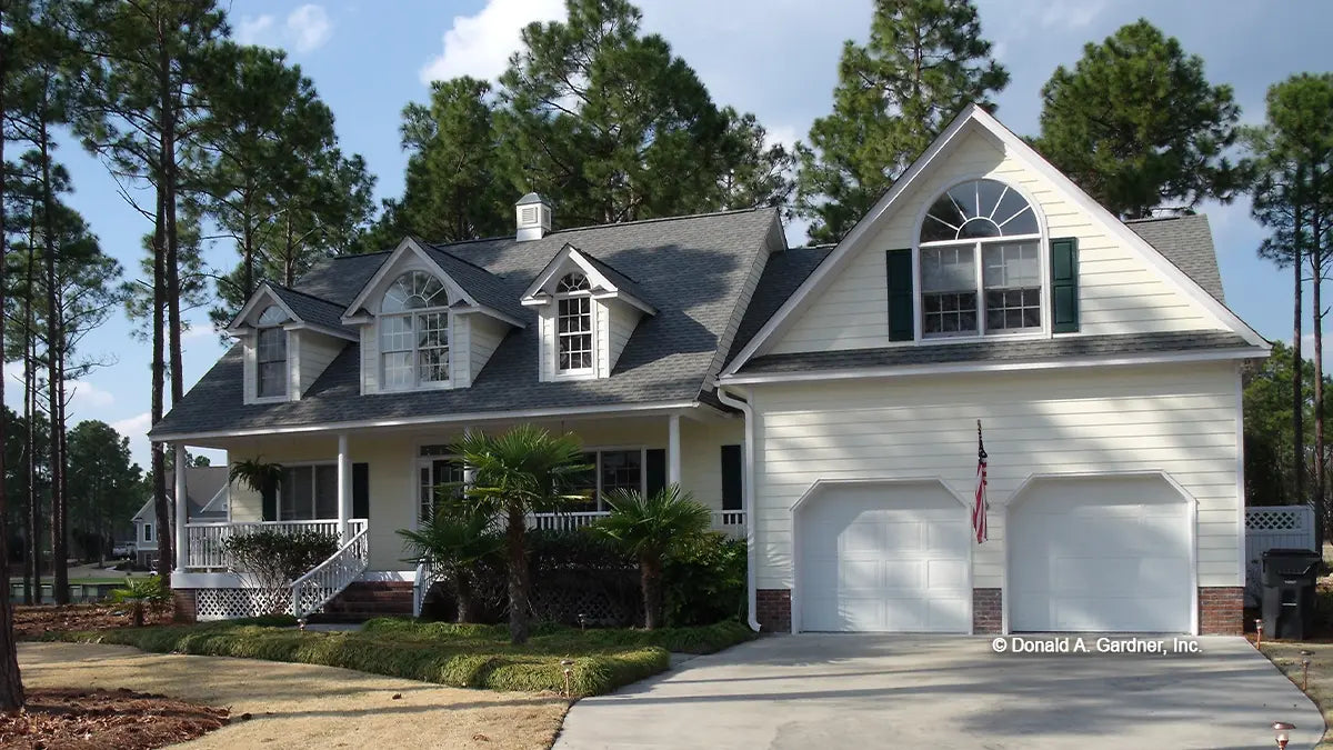 This is a front view photograph of a one-story country home. The Riverbirch plan 782.