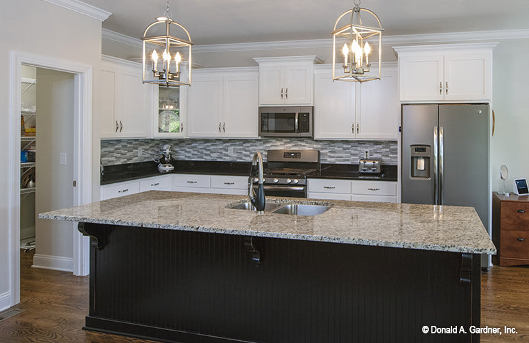 Kitchen picture with island and sink of  Riverpointe house plan 1247 