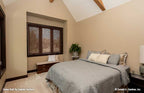 A secondary bedroom for cottage house plan 1406 The Roark