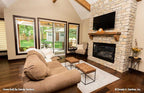 The great room is the primary gathering and entertainment space for cottage house plan 1406 The Roark
