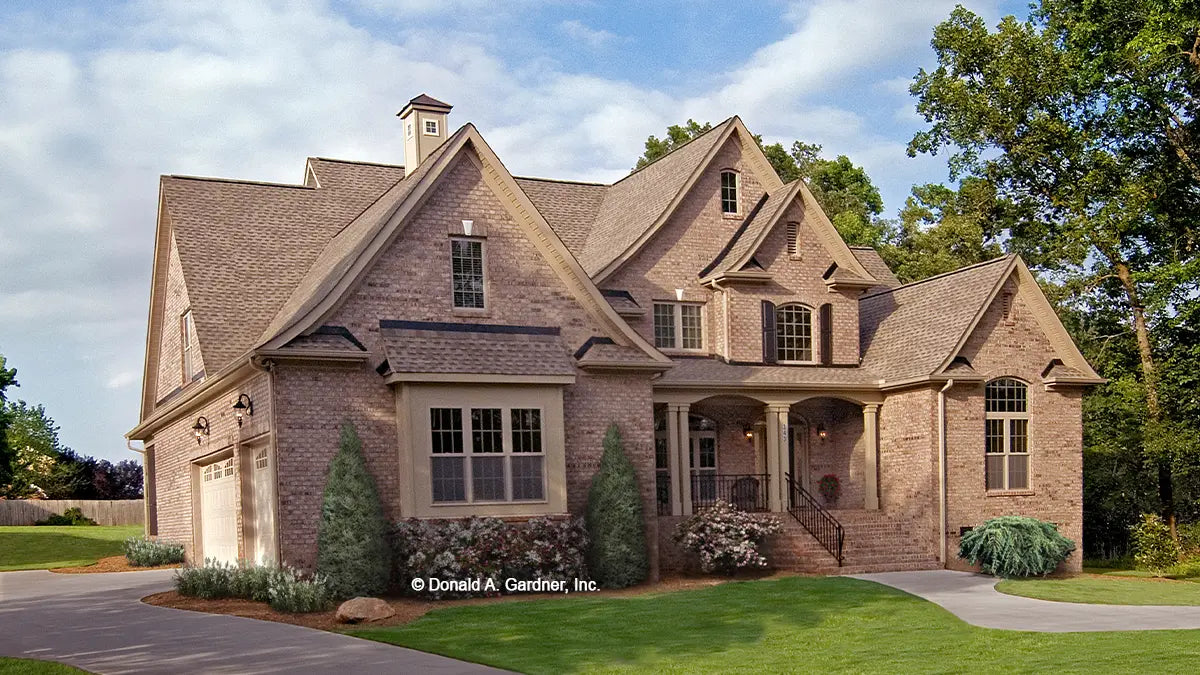 This is a photograph of the front of two story house plan 1204 The Rochelle as built by a customer