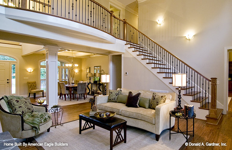 This is a great room and second floor railing picture of five bedroom house plan 1204 The Rochelle