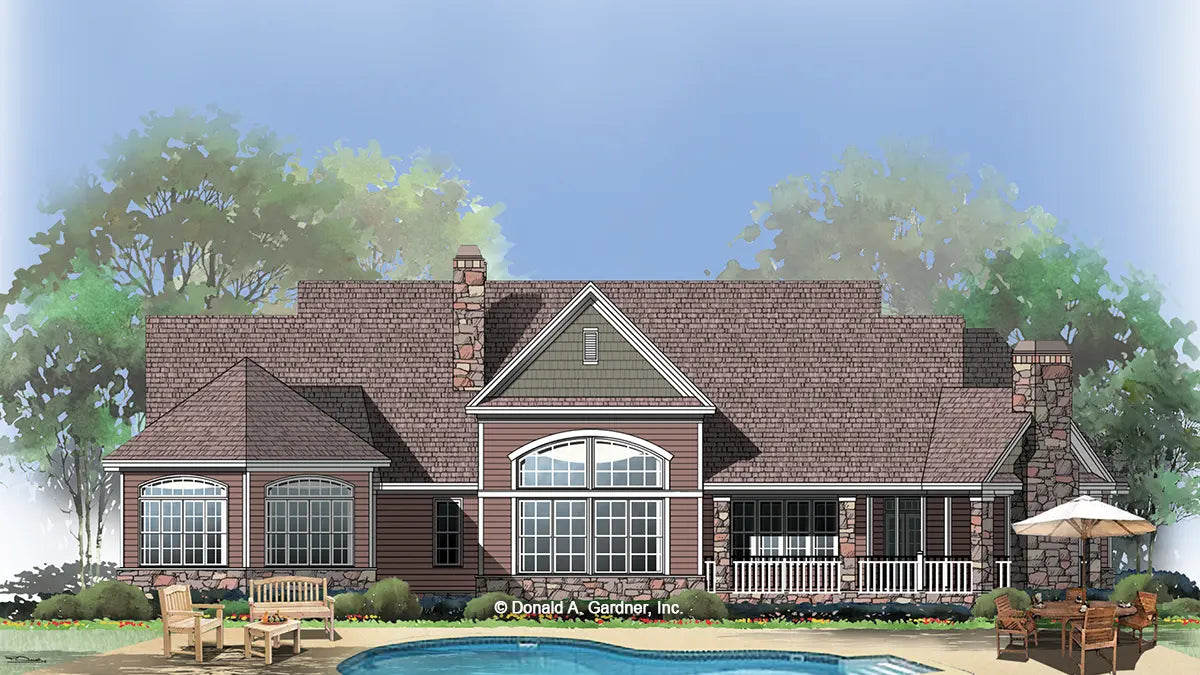 large windows, covered patio and s screened porch with a fireplace define the rear of this home