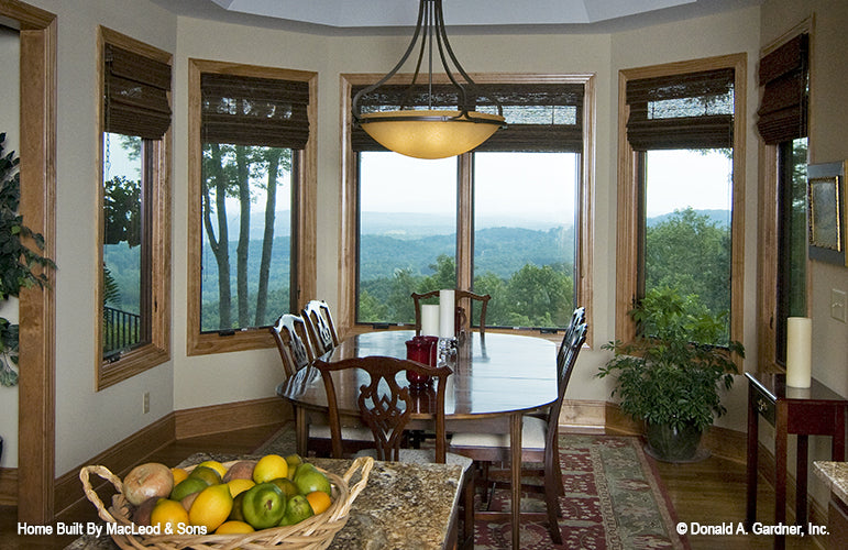 Six windows curved around the dining room. The Rockledge plan 875.