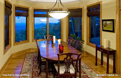 Stained wood trim and baseboards in the dining room. The Rockledge plan 875.