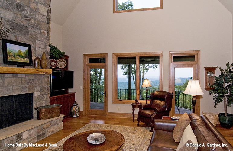 Two patio doors separated by windows in the great room. The Rockledge plan 875.