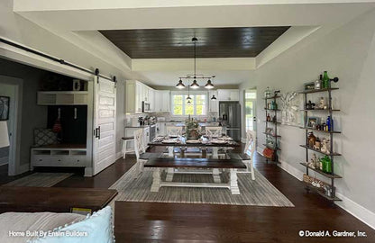 Tray ceiling with stained wood accent on the ceiling in the dining room. The Rogers plan 1383. 