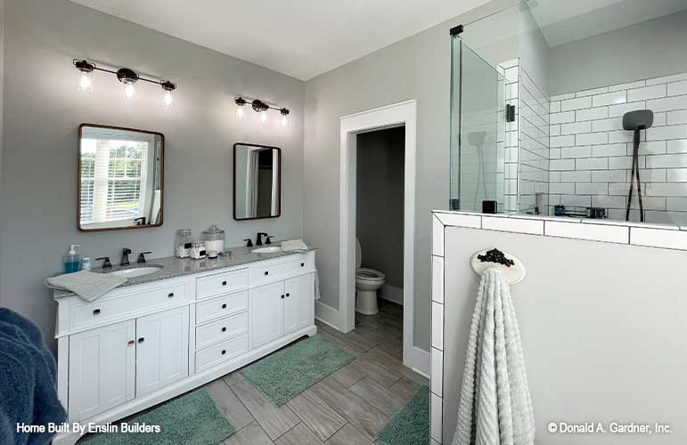 Double sink vanity across from the walk-in shower in the master bathroom. The Rogers plan 1383. 