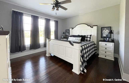 Triple windows in the master bedroom. The Rogers plan 1383. 