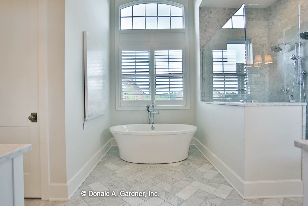 A garden tub provides peak relaxation in house plan 1378 The Roseburg