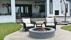 A firepit extends outdoor living to the patio of one story house plan 1378 The Roseburg