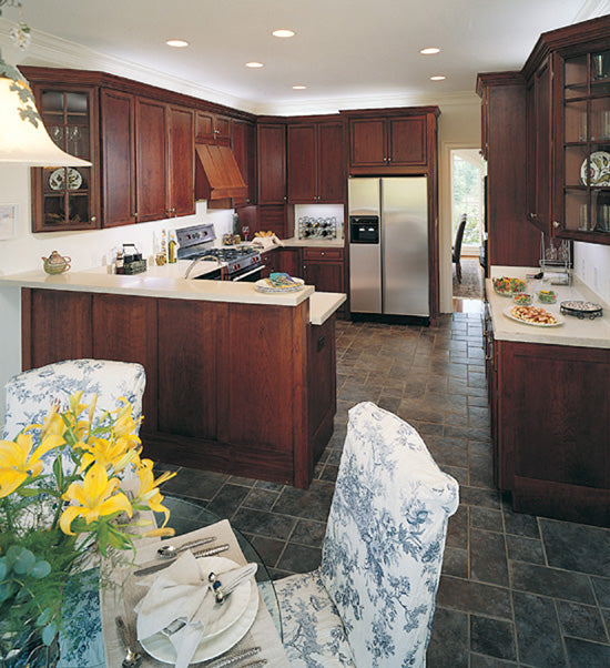 Brown cabinets in the kitchen. The Rousseau plan 451.