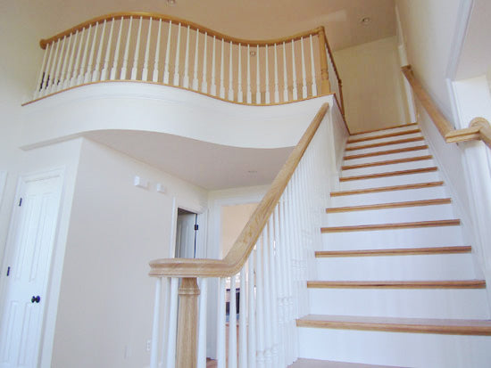 Light wood stain and white staircase. The Rousseau plan 451.