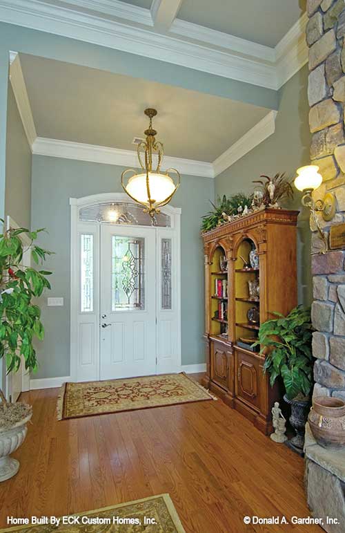 Crown molding and chandelier in the foyer. The Rowan plan 1366. 