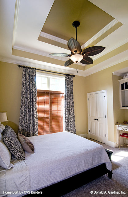 Tray ceiling and double closet doors in secondary bedroom. The Runnymeade plan 1164.