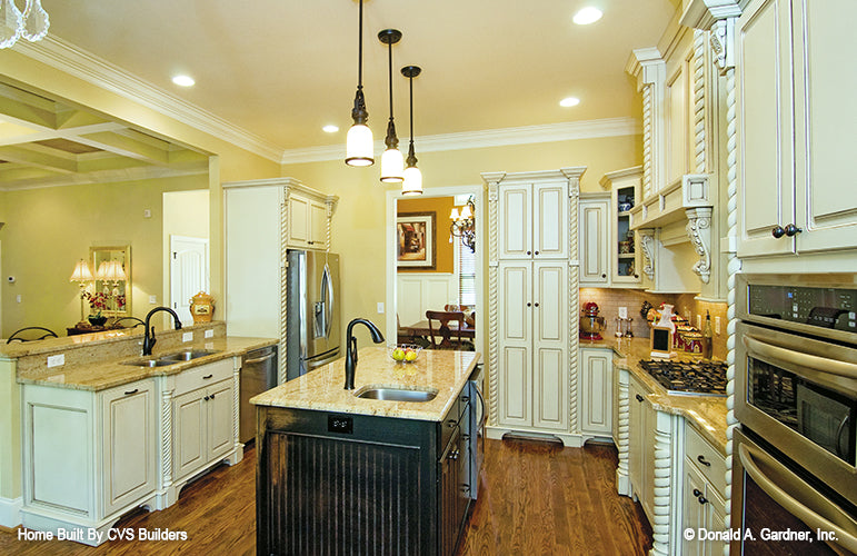 Two sink options in the kitchen, one off the counter and the other in the island. The Runnymeade plan 1164.