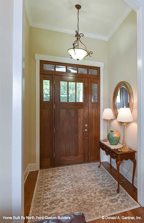 The foyer makes the first impression for visitors to Craftsman house plan 1329 The Sandy Creek